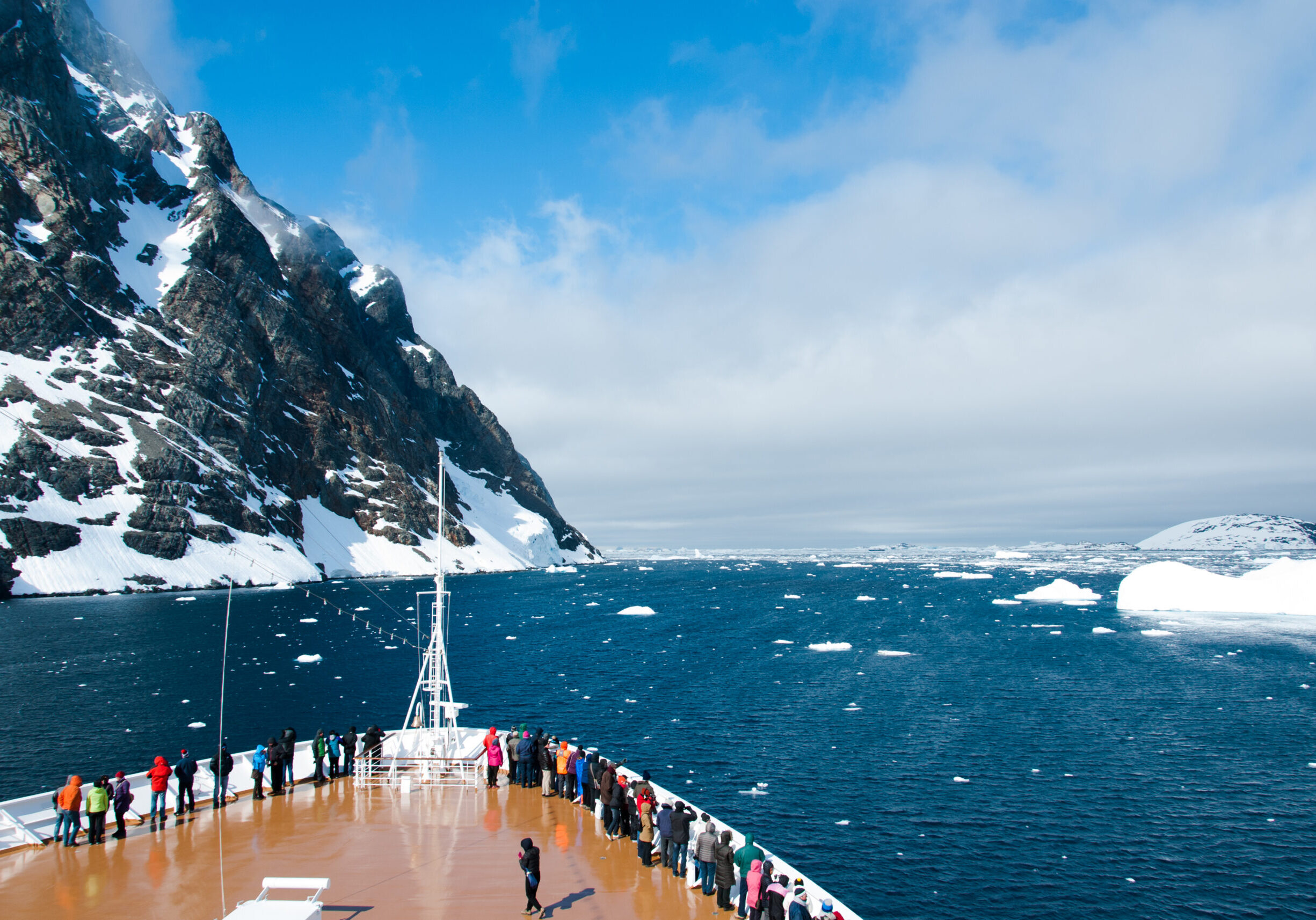 Cruise ship in the waters of Antarctica between mountains and ic